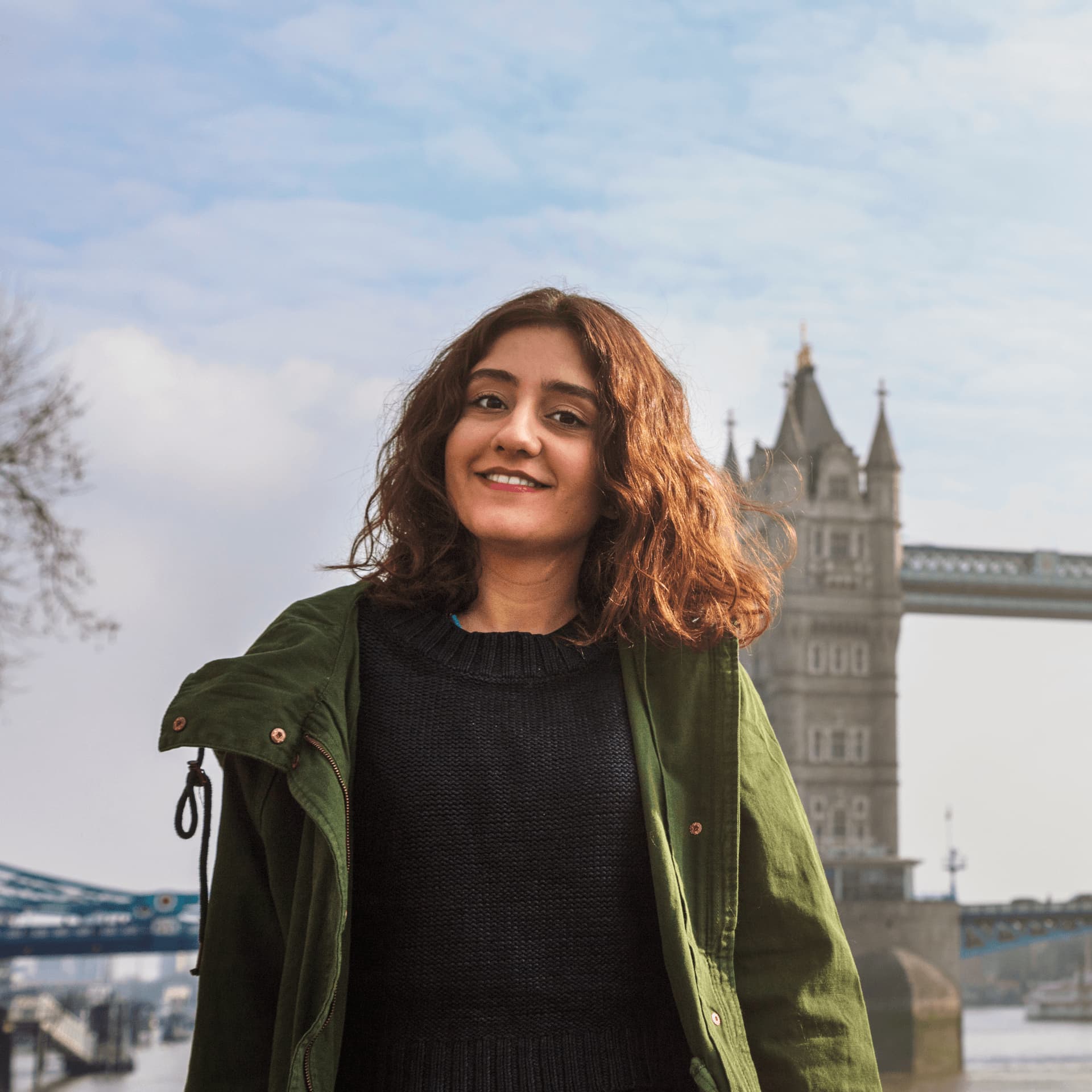 Young student stood in front of London Tower Bridge near the Walbrook office.