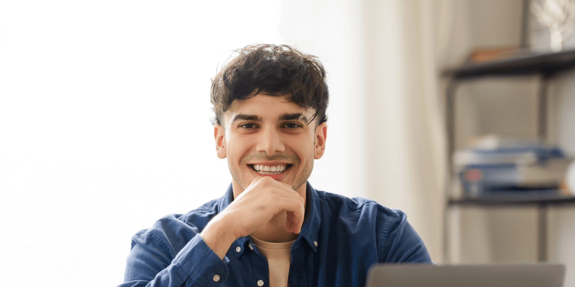 Male student studying from home starting their degree in january