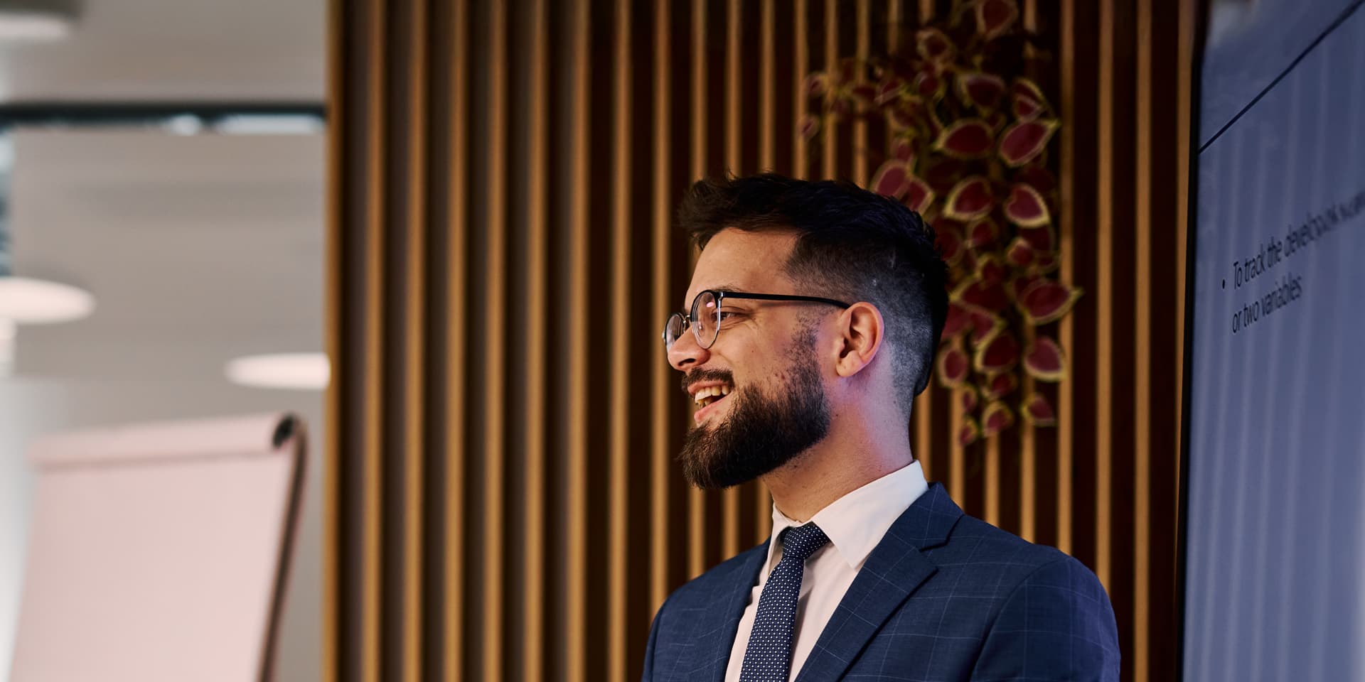 Smiling professional running a meeting about current financial markets and risk management.