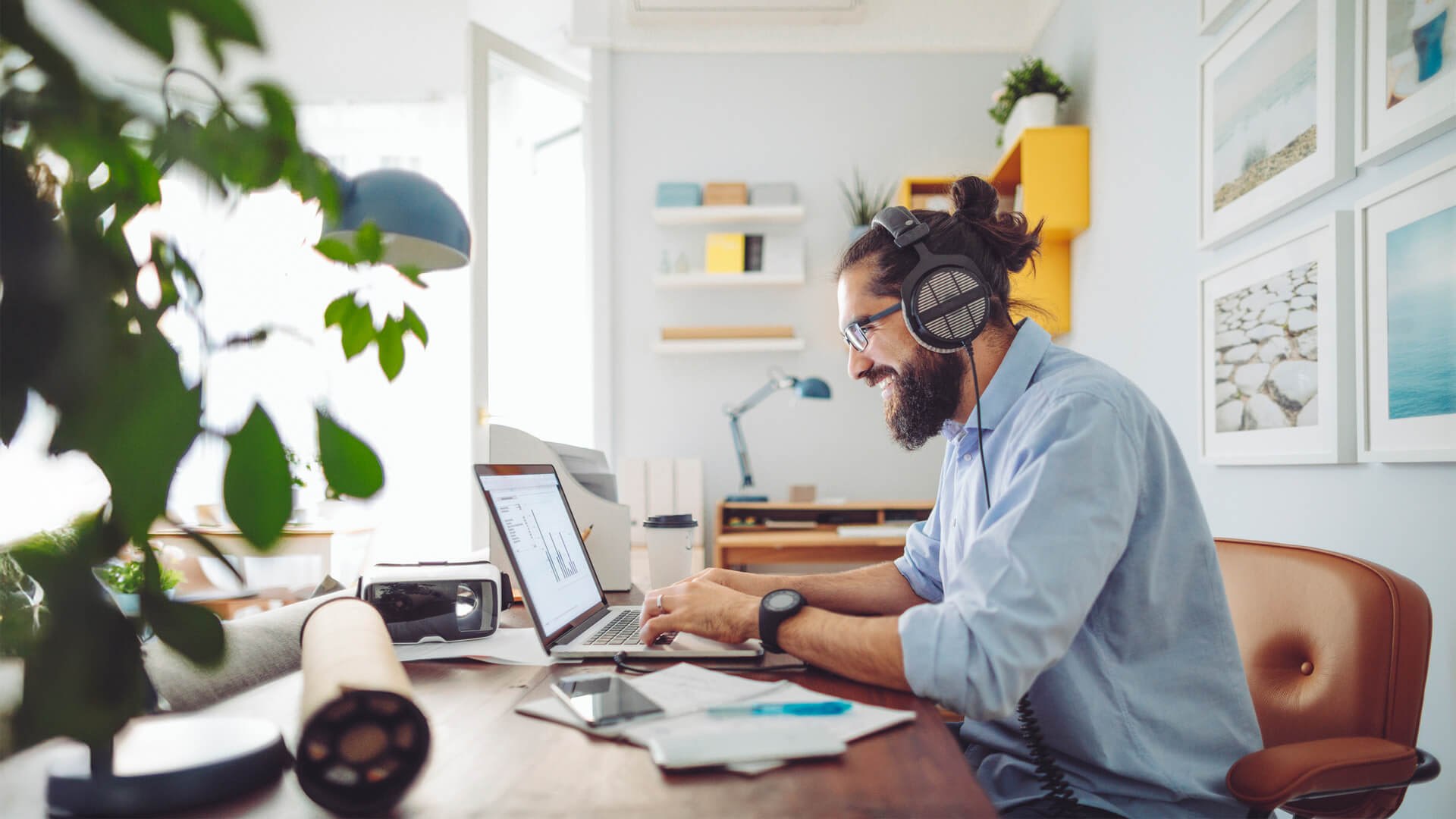 Online MBA graduate works remotely, applying AI concepts to real-world tasks in a flexible work session.