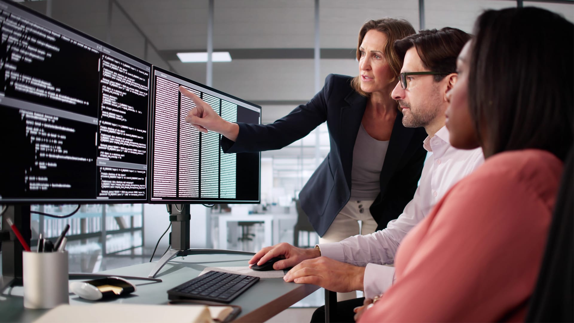 A senior AI architect explaining an artificial intelligence system to a group of colleagues.
